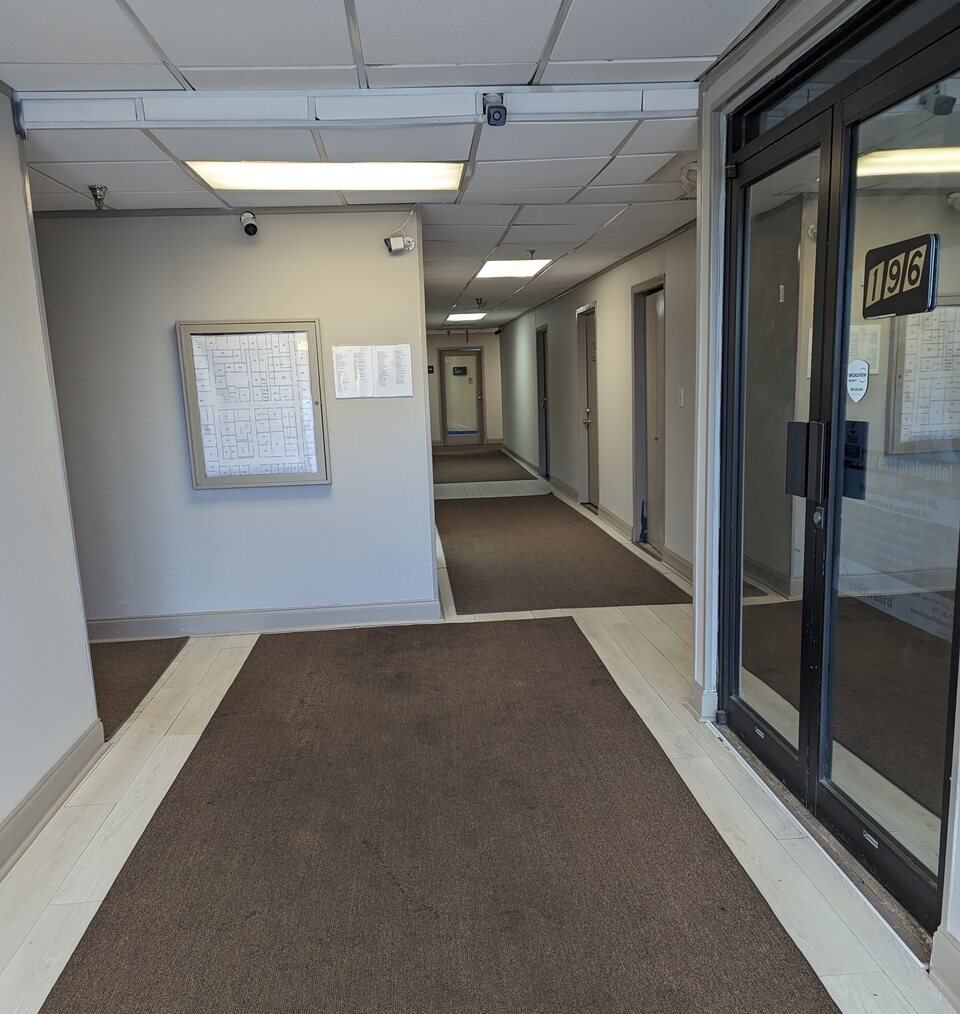 Interior corridor and suite doors at Airport Center.
